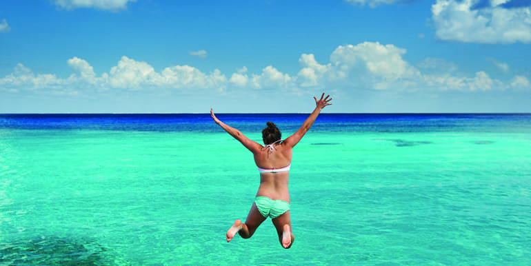 Girl jumping in the water