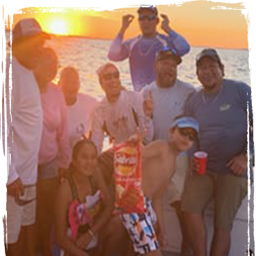 Family looking at tropical fish