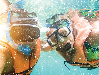 Woman snorkeling in isla mujeres