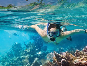 Woman snorkeling in isla mujeres
